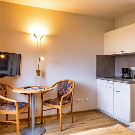 - Zum Hotel *